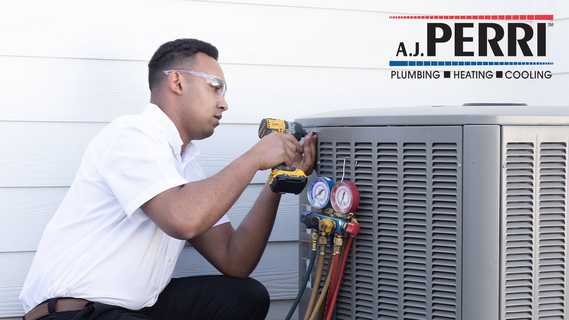 A.J. Perri technician performing air conditioning maintenance and tune-up services